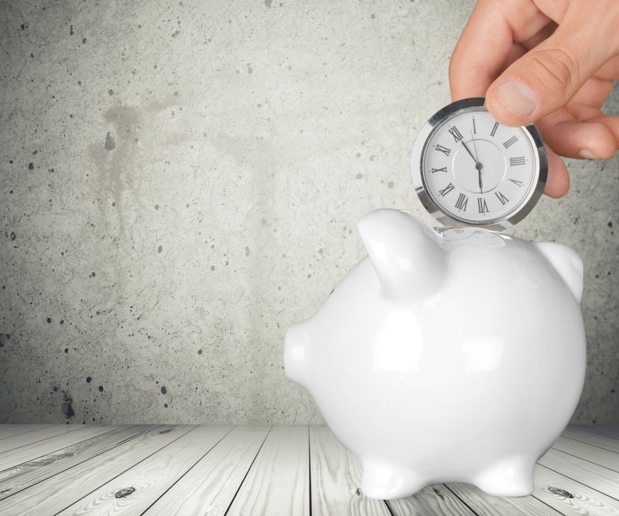 putting a stop watch in a piggy bank.jpg