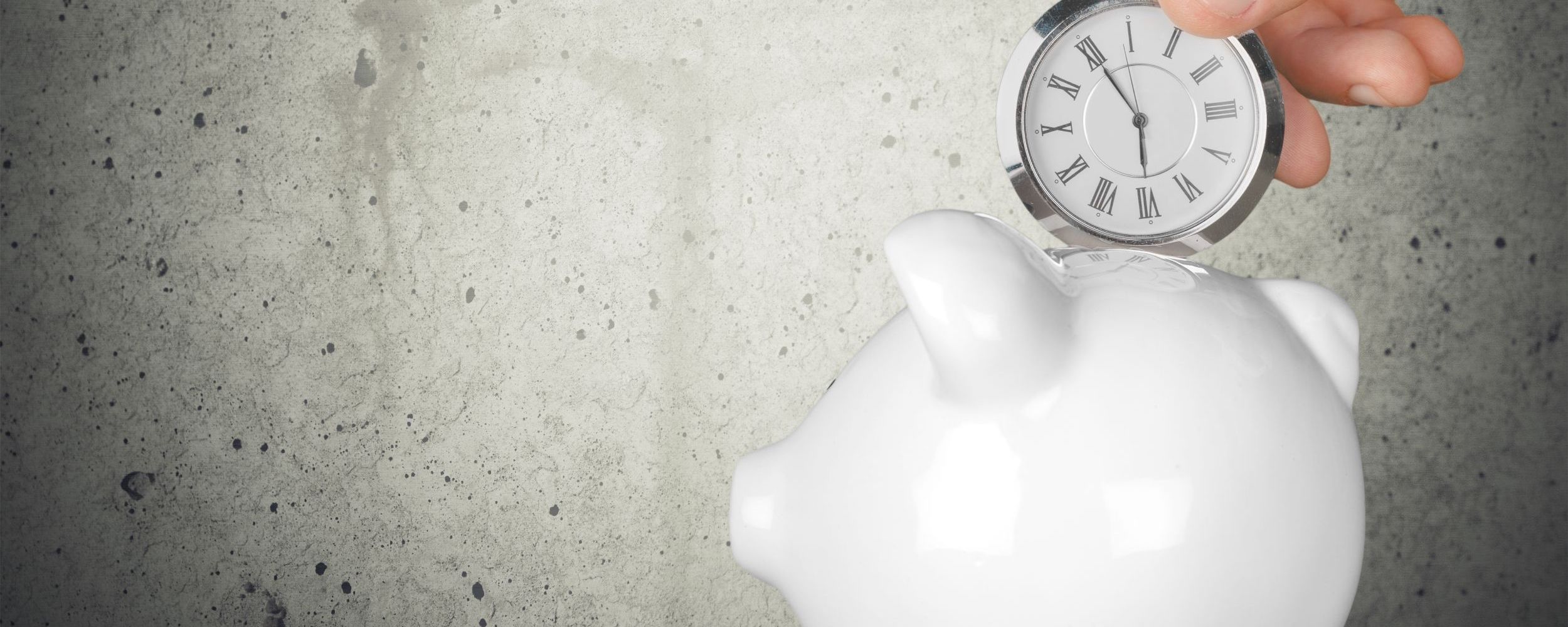 putting a stop watch in a piggy bank.jpg