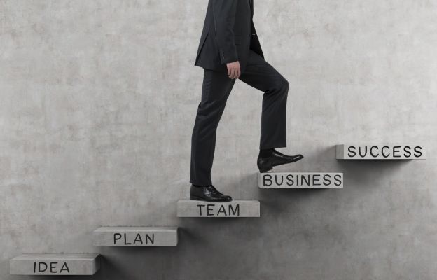 business man following the steps to sucess.jpg